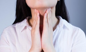 woman-feeling-lymph-nodes-under-chin-for-lump.jpg